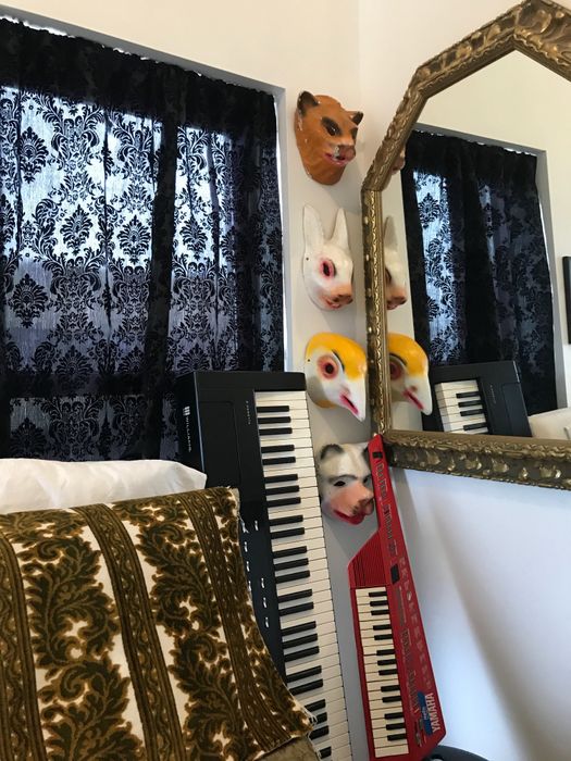 Another window in her bedroom, also adorned with the same elegant curtains.