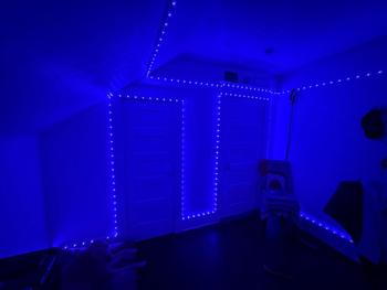 Room featuring blue LED strip lights