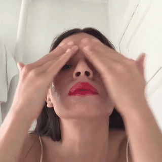 GIF of model removing makeup.