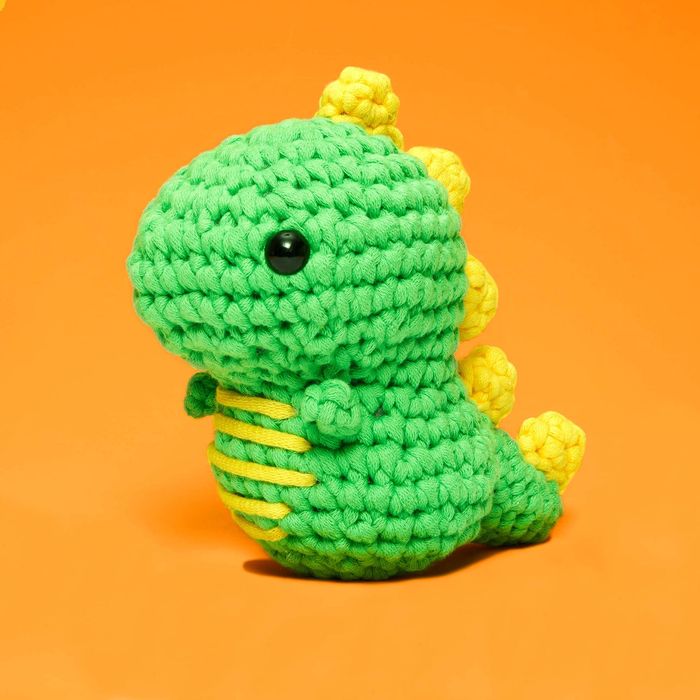 A handmade crocheted dinosaur.