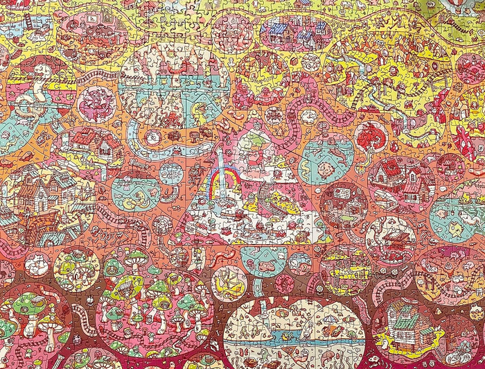 A completed, colorful jigsaw puzzle displayed by the reviewer.