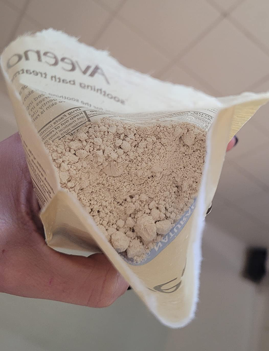 a reviewer demonstrating the oatmeal bath soak