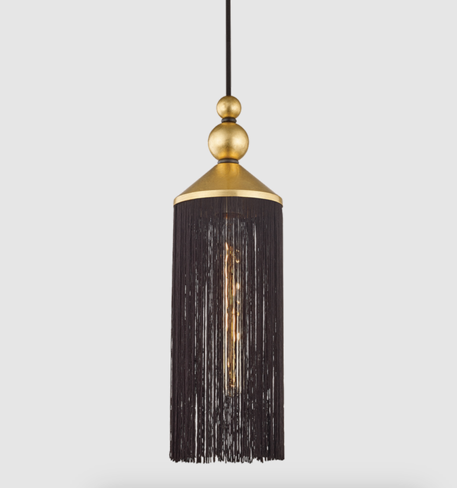 A sophisticated pendant light with a tassel design and a central bulb, perfect for adding an elegant, chic vibe to any interior.
