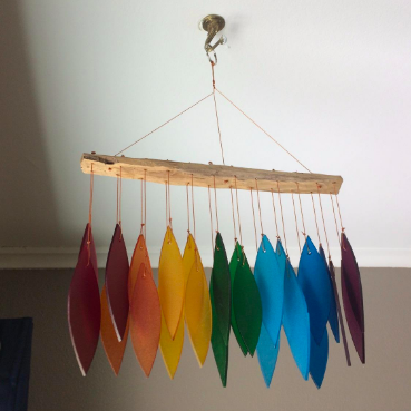 The reviewer has placed the piece on their ceiling, suspending it for display.