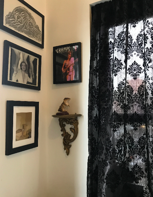 A glimpse of my sister-in-law's bedroom, featuring black patterned Victorian-style curtains that add an old-world charm.