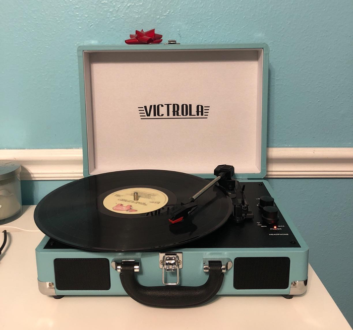 blue turntable with a vinyl record on it