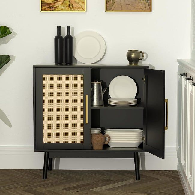 A cabinet with one side open, revealing two shelves and plates inside.