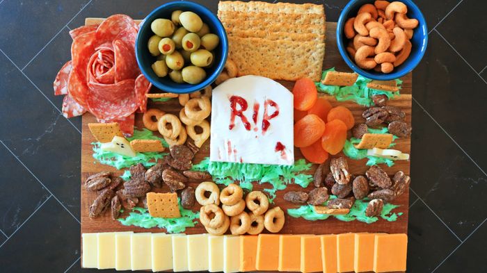 A finished Halloween-themed meat and cheese board.