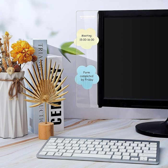 A sticky note monitor memo board attached to a computer monitor