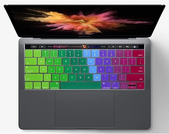 A colorful rainbow silicone keyboard cover fitted on a laptop