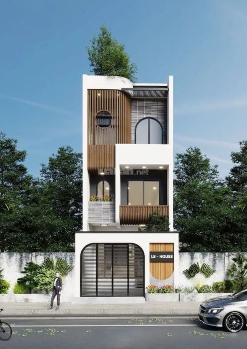 Mẫu nhà ống 3 tầng hiện đại với mặt tiền kết hợp vật liệu kính, tạo nên vẻ đẹp sang trọng và hiện đại.