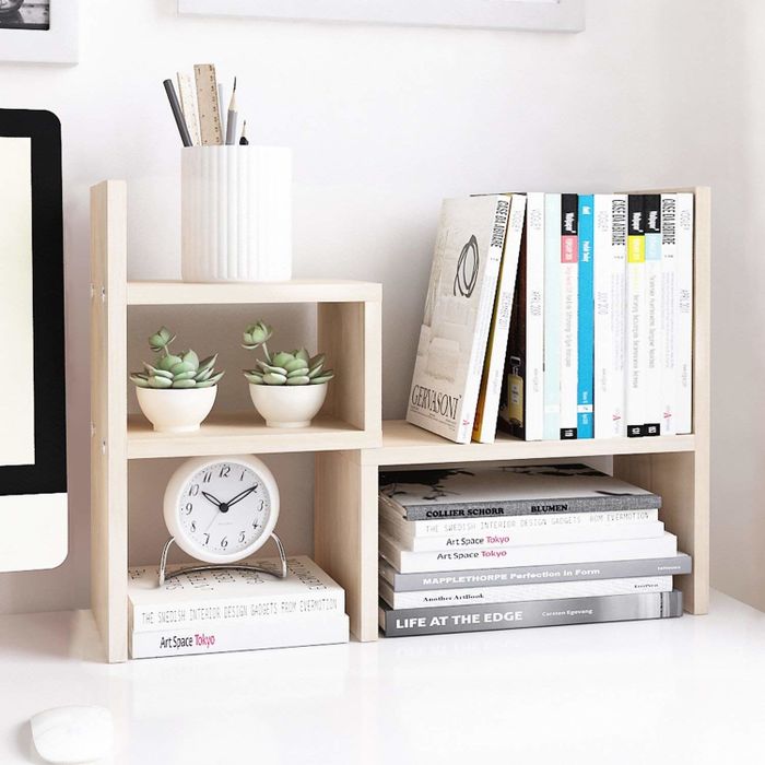 Display shelves elegantly arranged on a white desk