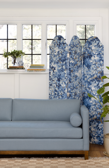 a scalloped screen with a blue floral design