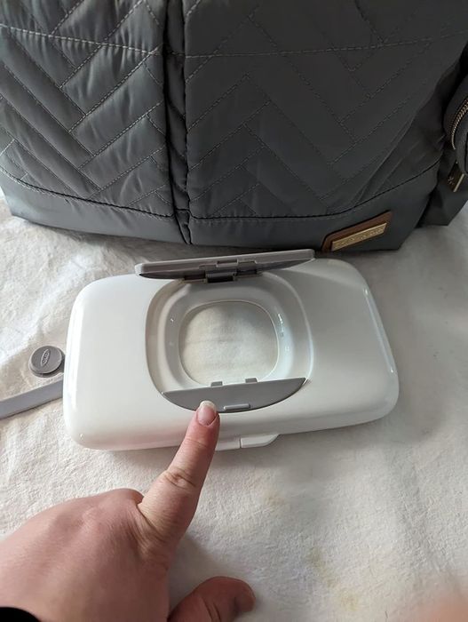 A container full of wipes ready for use.