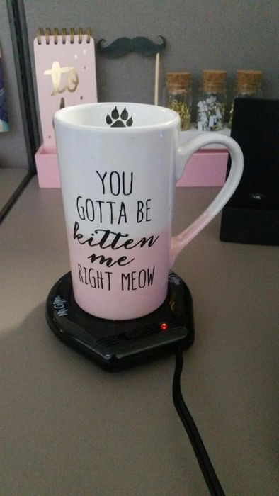 Reviewer's mug resting on a mug warmer