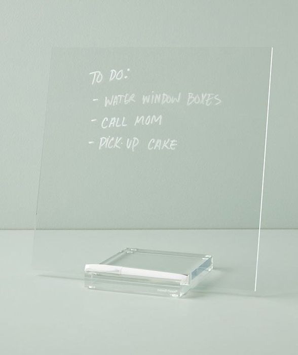 Acrylic dry erase board filled with handwritten memos