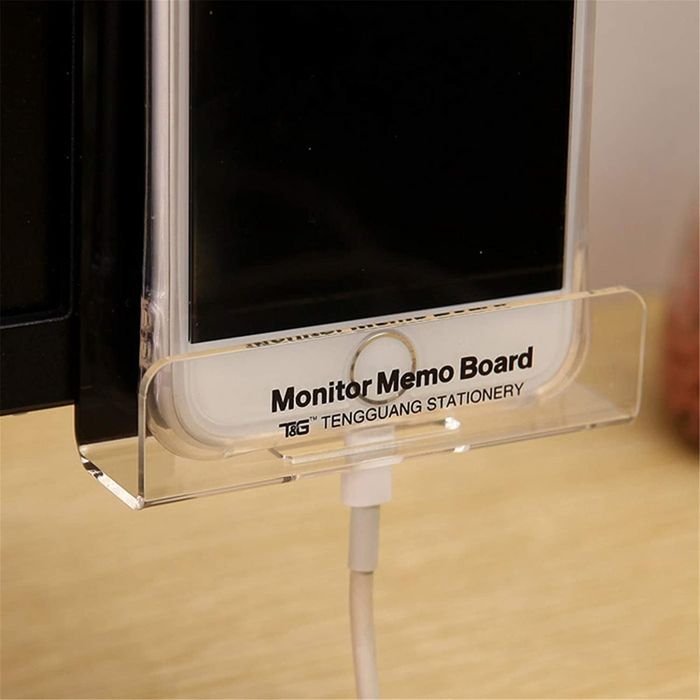 Close-up of the bottom section, showing space for a phone and charging cord