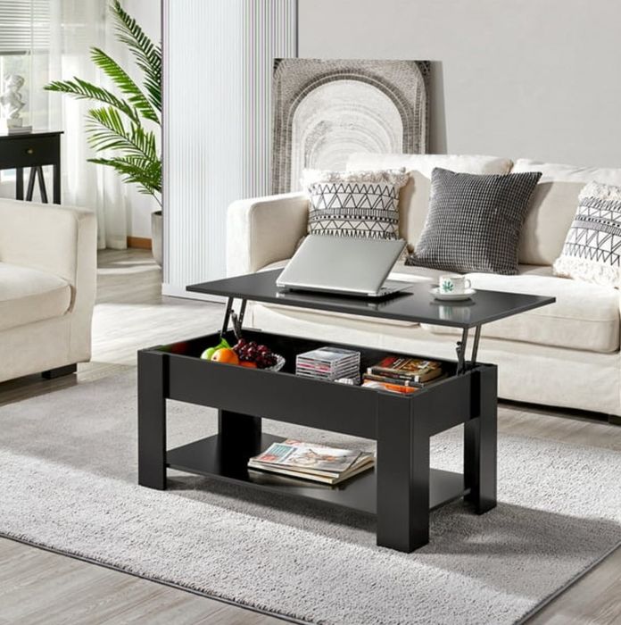 A modern living room with a lift-top coffee table, sofa, and decorative accents.