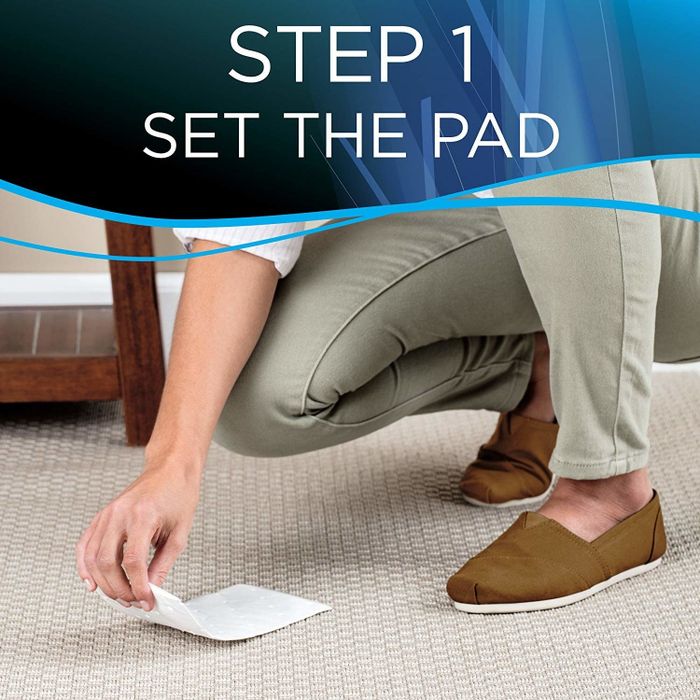 A model demonstrating step one: placing the pad on the stain.
