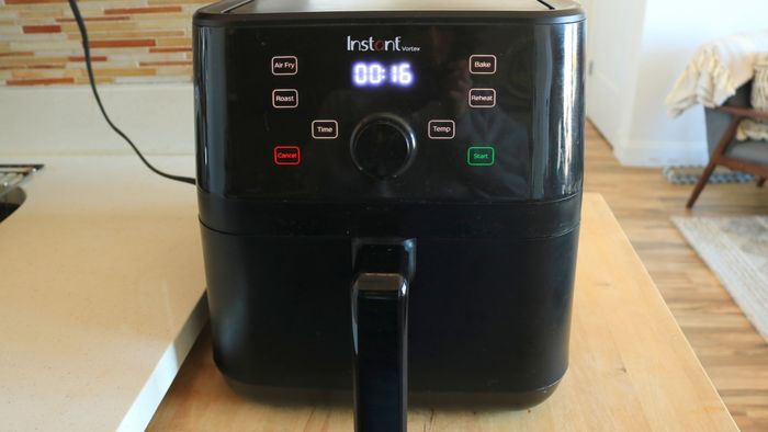 The Instant Vortex air fryer placed on a kitchen countertop.