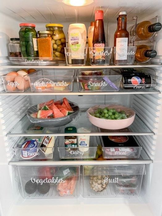 A photo of the inside of a fridge featuring neatly placed storage labels.