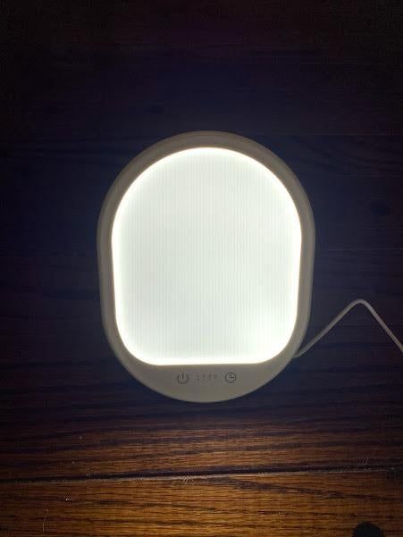 Reviewer photo showcasing the light therapy lamp