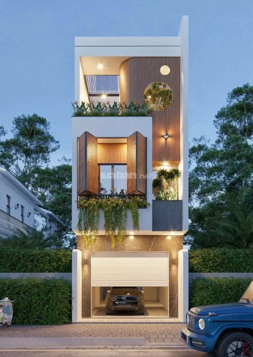 Mẫu nhà hiện đại, thoáng đãng, kết hợp với gara ô tô, mang lại không gian sống tiện nghi và hiện đại.
