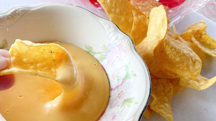 Prepare a gooey, stretchy cheese sauce using lemon juice and baking soda