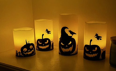 four pumpkin-themed candles shown in the review photo