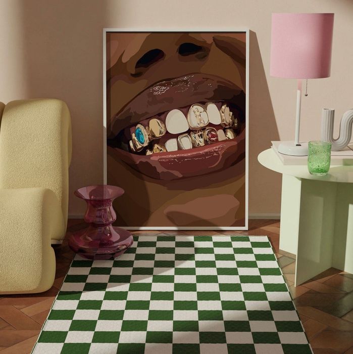 An illustration of a mouth adorned with decorative teeth, displayed as art in a room.