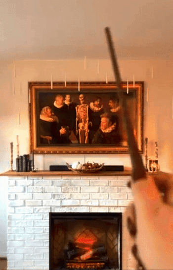 GIF of a reviewer using the magic wand to turn on the lights