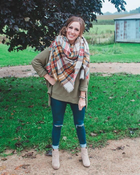 Another reviewer modeling the olive green sweater