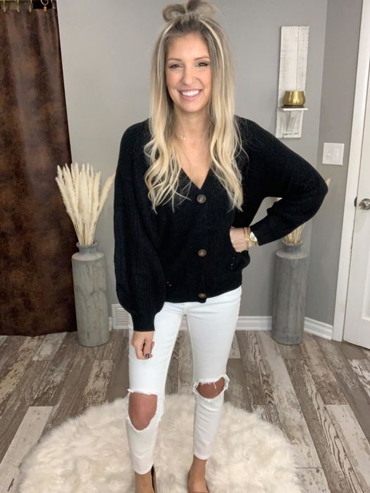 Another reviewer modeling the black sweater