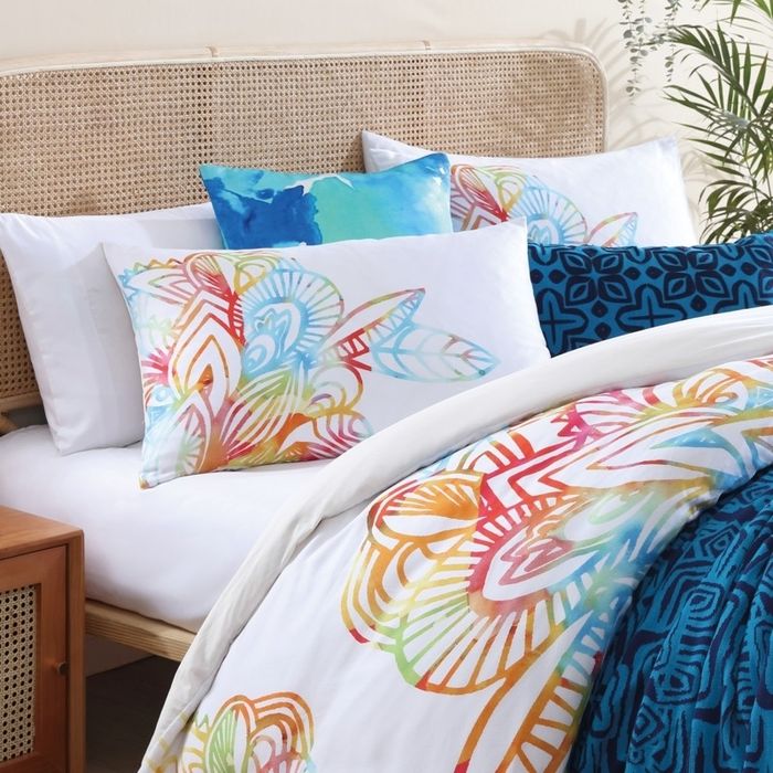 A beautifully arranged bed set is displayed