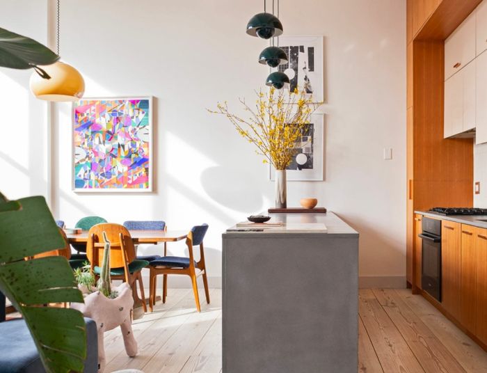 A stunning kitchen and dining area showcase a complete renovation