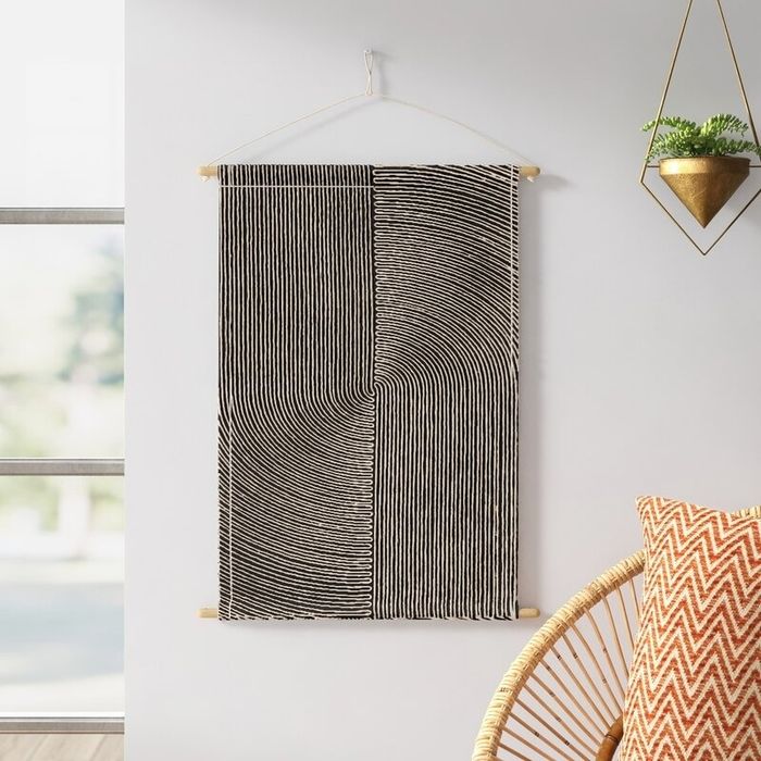 a modern-patterned cotton wall hanging displayed on a wall