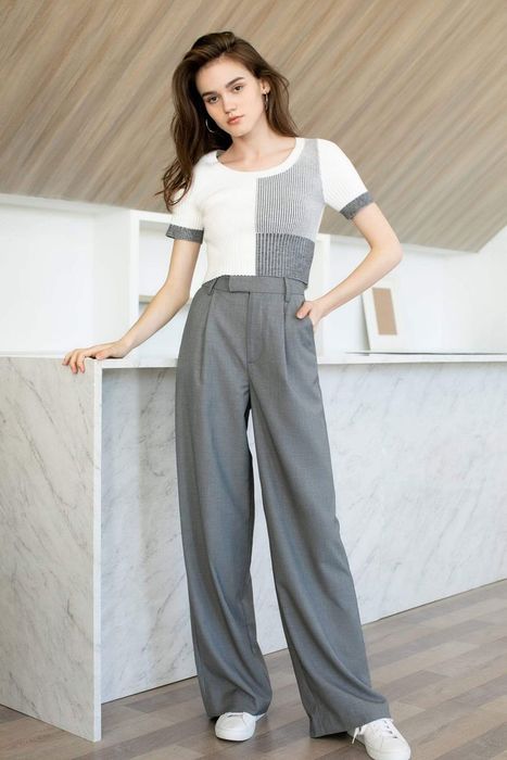 model wearing the top paired with grey dress pants