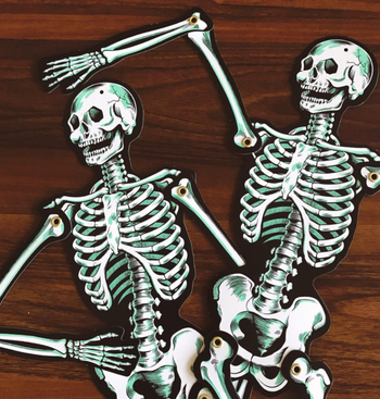 reviewer's paper skeletons with their arms bent into fun poses