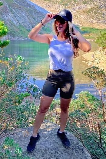 reviewer wearing the white crop top with shorts