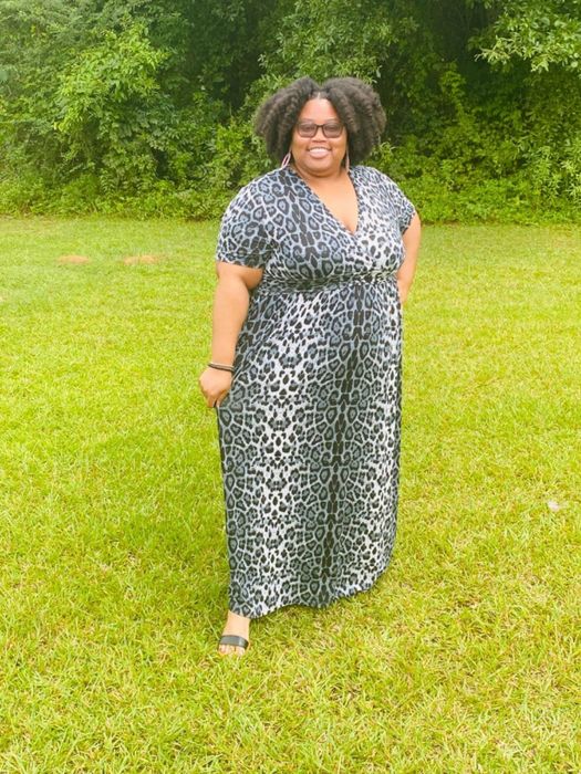 another reviewer modeling the black and grey cheetah print dress