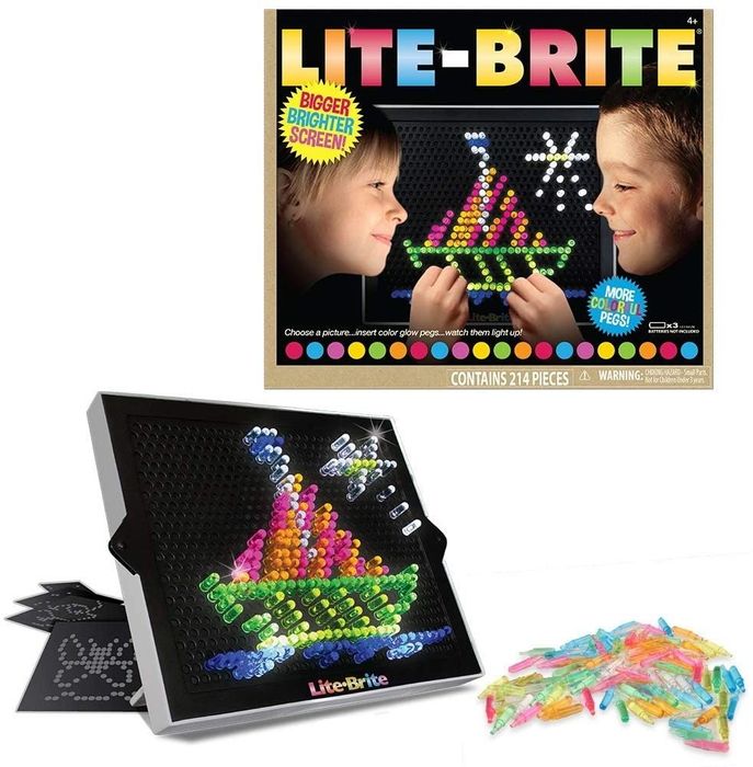The Lite-Brite board displaying a ship design made with pegs, alongside colorful pegs and its packaging