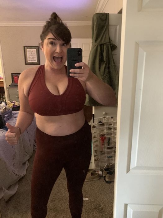 reviewer in the burgundy bra paired with matching leggings