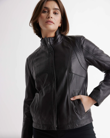 model displaying the jacket zipped up, highlighting the shoulder stitching