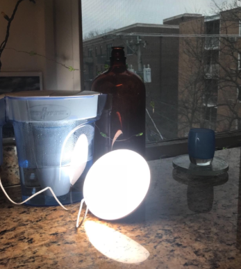 The lamp emits a warm, sunlight-like glow.