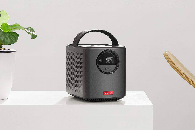 A mini projector with a convenient handle for easy portability.