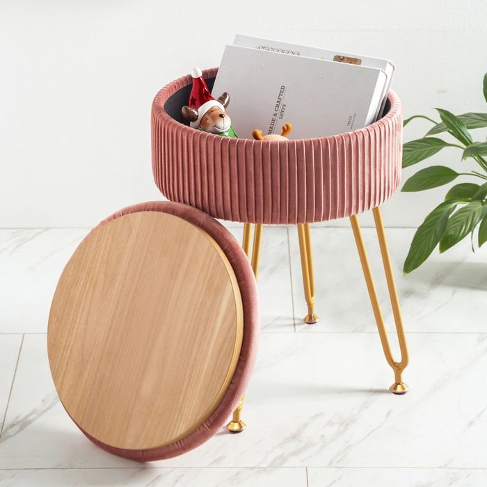 A view of the storage ottoman's interior, showcasing its spacious compartment.