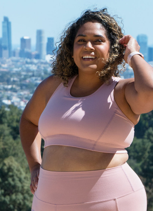 model wearing the blush-colored sports bra