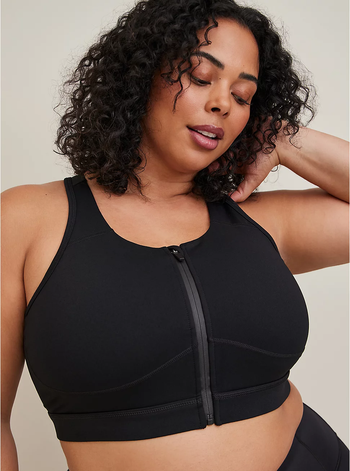 model wearing the black zip-up sports bra