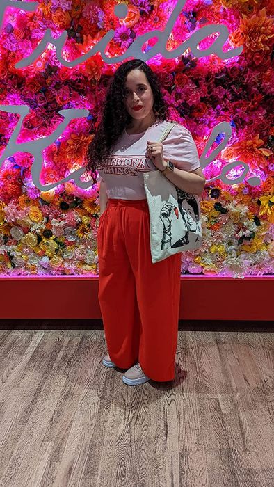 reviewer showcasing the red pants