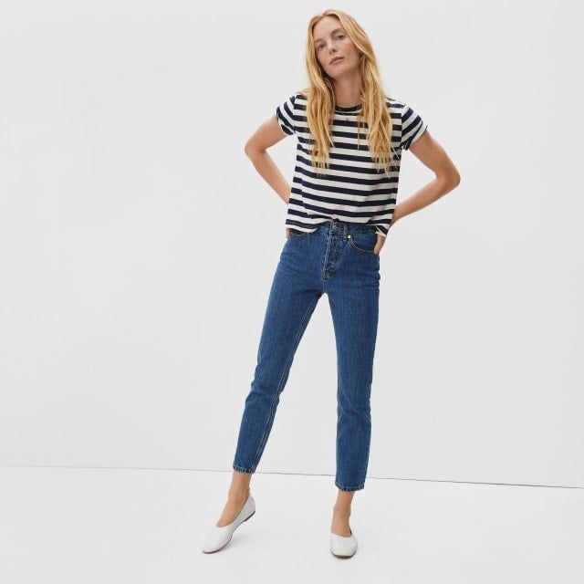 model wearing the dark blue jeans